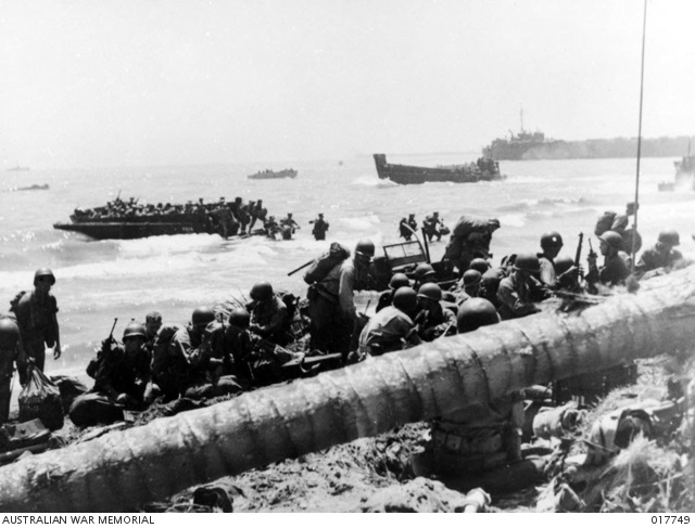 4048049 Leyte Island 20 Oct 1944. First wave of Allied troops surging across beach north of Palo during invasion. AWM 017749.jpg