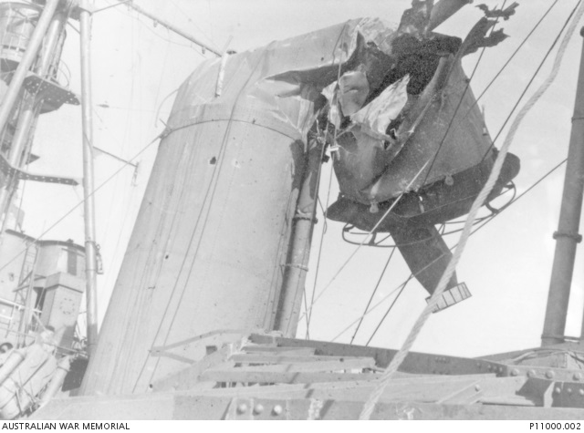 4303130 Damage to forward funnel of HMAS Australia from kamikaze attack at Lingayen Gulf 9 Jan 1945. AWM.jpg