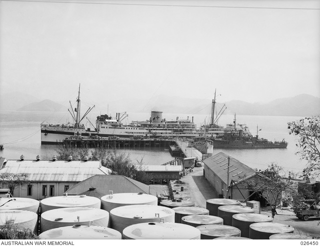 9131153 Manunda Hospital Ship at Port Moresby August 1942 being loaded with wounded soldiers to be transferred to Australia. AWM.jpg